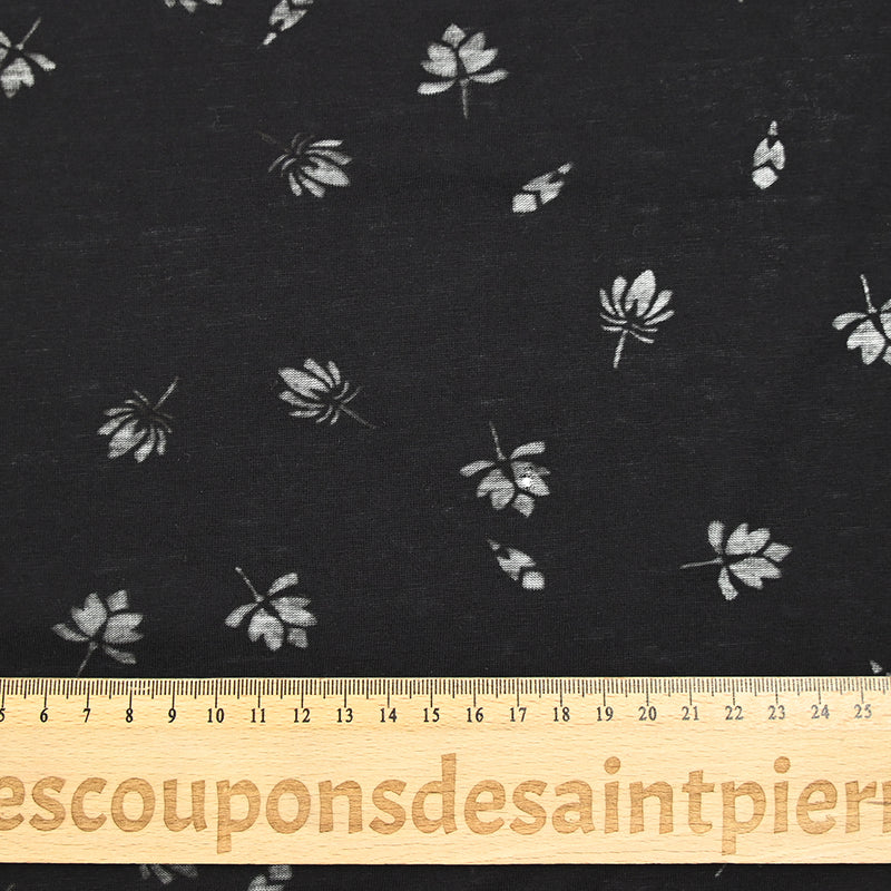 Jersey de coton fin ajouré feuilles fond noir