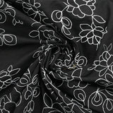 Cotton sail embroidered with enchanted flowers black background