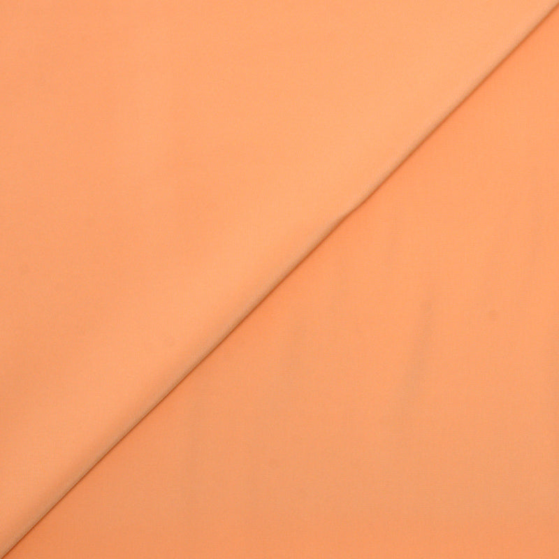 Voile de polyester satin fin orange pâle