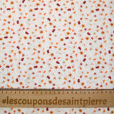 Coton imprimé au gré du vent orange fond blanc