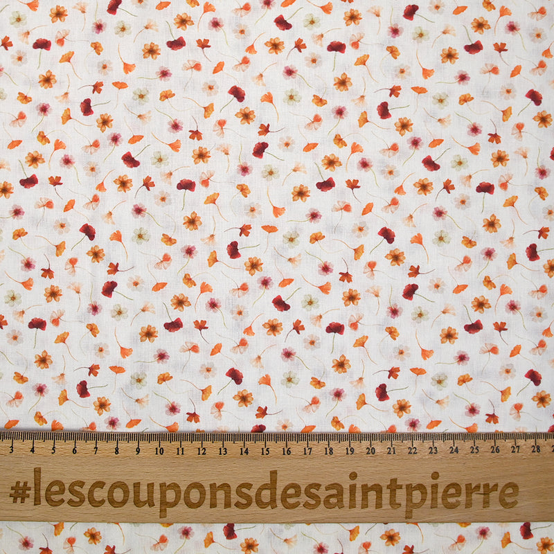 Coton imprimé au gré du vent orange fond blanc