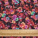Coton imprimé fleuri graphique rouge, fuchsia et turquoise fond noir