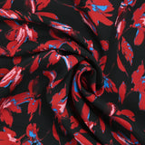 Viscose imprimée fleurs enchantées rouge et bleu fond noir