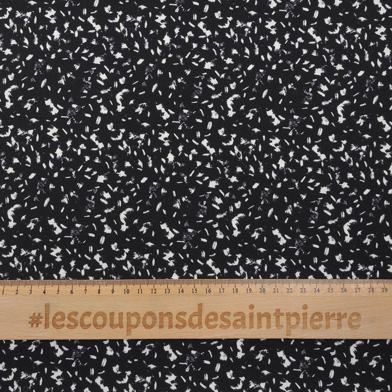 Crêpe polyester imprimé graphique taches blanches fond noir