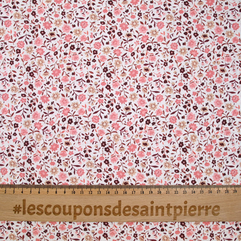 Coton imprimé ouragan floral rose fond blanc
