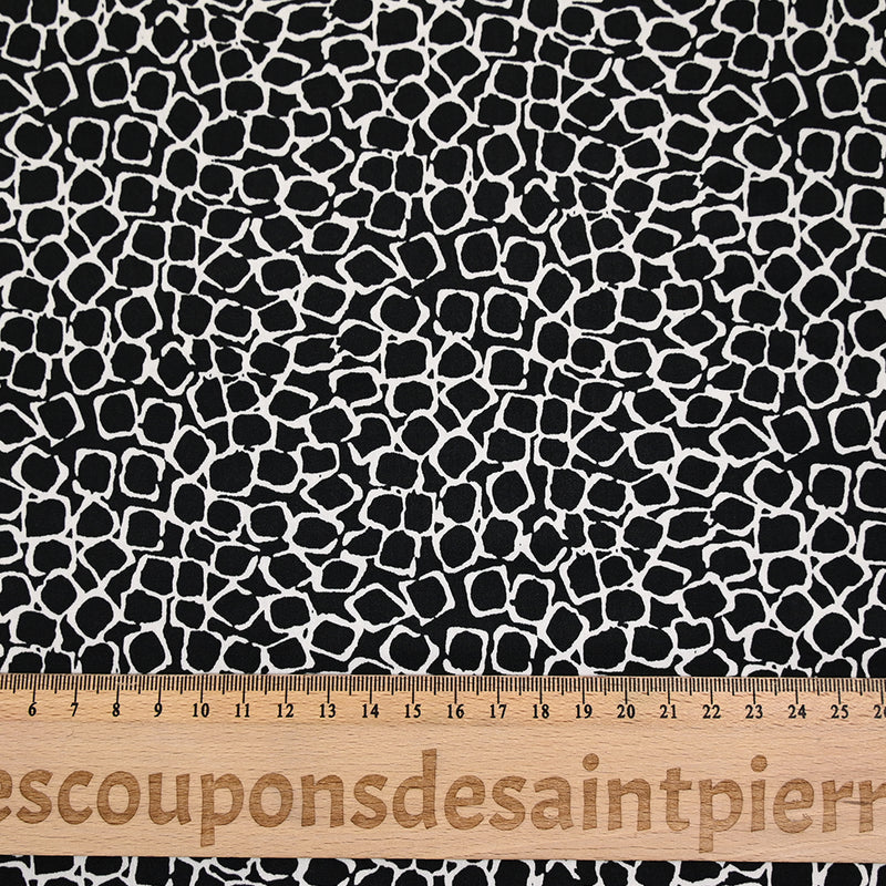 Jersey polyester écailles fond noir