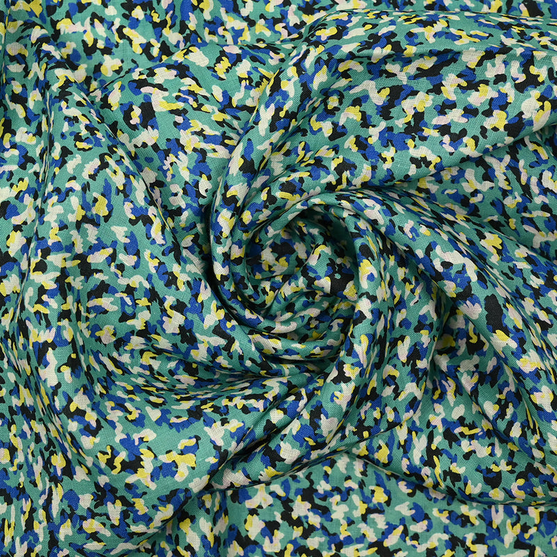 Toile viscose imprimée particules fond turquoise