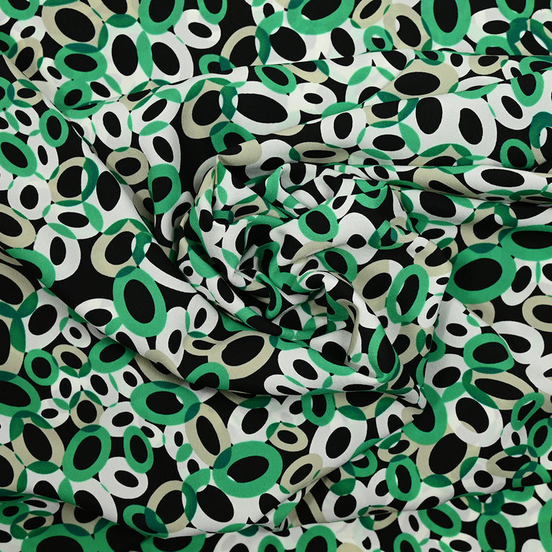 Crêpe de polyester imprimé cercle vert fond noir
