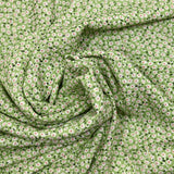 Popeline viscose imprimée lurex mini fleurs fond vert clair