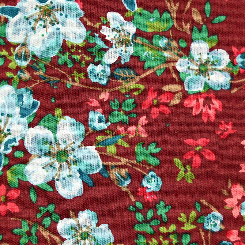 Coton imprimé à fleurs fond rouge bordeaux