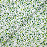 Coton imprimé ouragan floral vert fond blanc