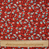 Crépon viscose lurex fleurs bleu et blanc fond rouge