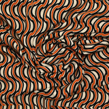 Twill de viscose imprimée à la file indienne orange fond beige clair