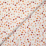 Coton imprimé au gré du vent orange fond blanc