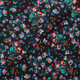 Crêpe viscose imprimé fleurs éclatantes vertes et orange fond noir