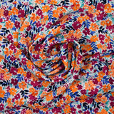 Crêpe de polyester imprimé picore nature orange fond blanc