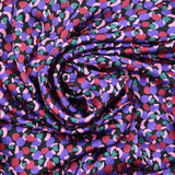 Crêpe satin polyester imprimé confettis violet fond noir