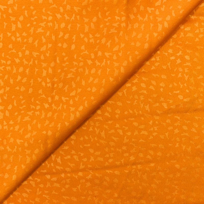 Crêpe satin de polyester Clarisse fond orange