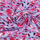 Viscose imprimée fleurs champi rose fond bleu