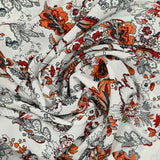 Crêpe de polyester imprimé fleurs sauvages fond blanc