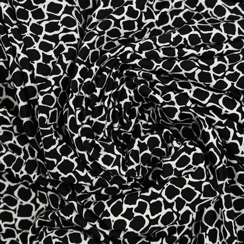 Jersey polyester écailles fond noir