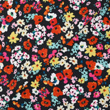 Crépon polyester fleuri multicolore fond noir