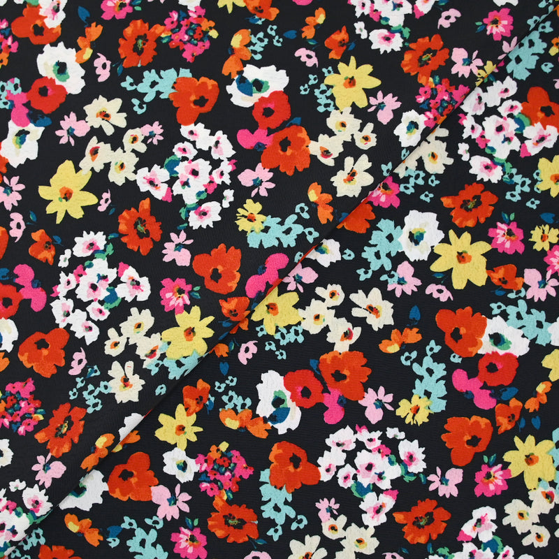 Crépon polyester fleuri multicolore fond noir