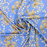 Satin imprimé polyester élasthane fleurs fond bleu