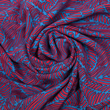Viscose imprimée fougères orange corail et bleu