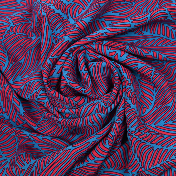 Viscose imprimée fougères orange corail et bleu