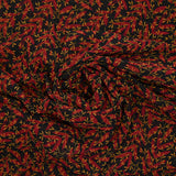 Mousseline imprimée feuilles rouge et ocre fond noir