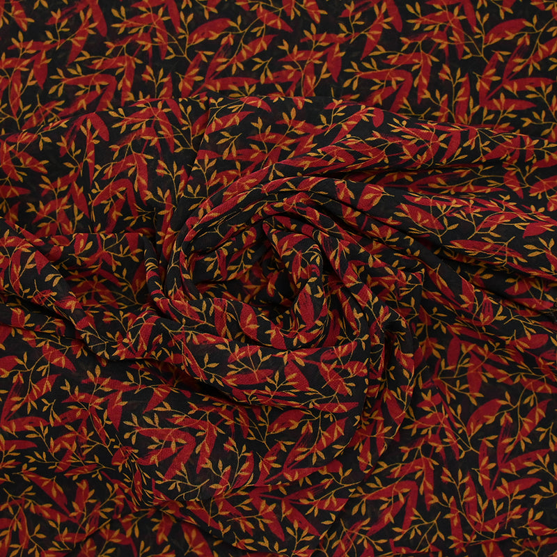 Mousseline imprimée feuilles rouge et ocre fond noir