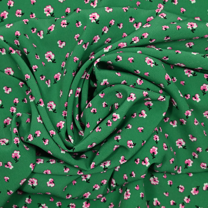 Crêpe de polyester imprimé pluie florale fond vert