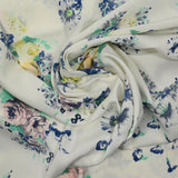 Fine printed viscose pink flowers, blue and turquoise white background
