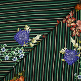 Jersey de viscose imprimé rayé vert et noir avec des fleurs
