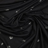 Jersey de coton fin ajouré feuilles fond noir