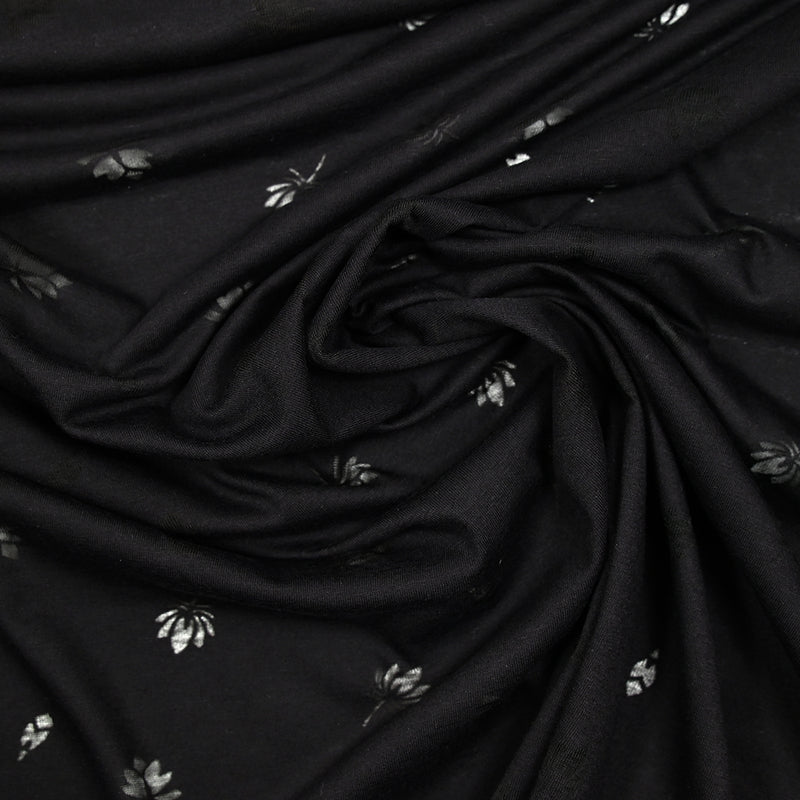 Jersey de coton fin ajouré feuilles fond noir