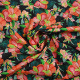 Coton imprimé fleurs exotiques corail et vert fond noir