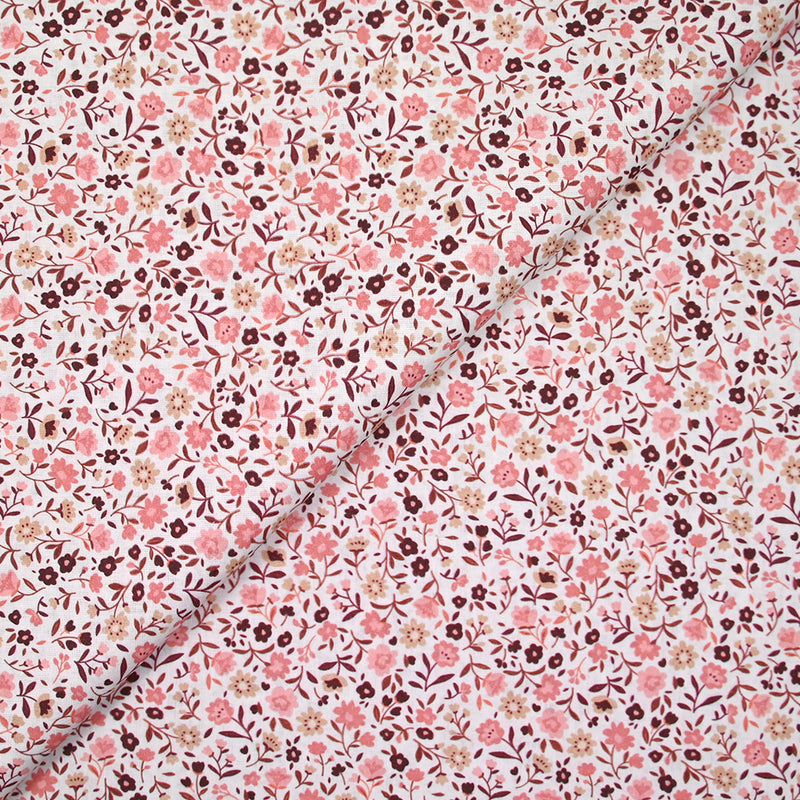 Coton imprimé ouragan floral rose fond blanc