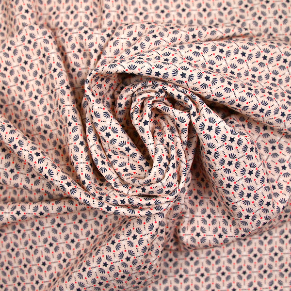 Crépon imprimé étoile marine fond rose chair