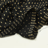 Voile de polyester plumetis beige fond noir