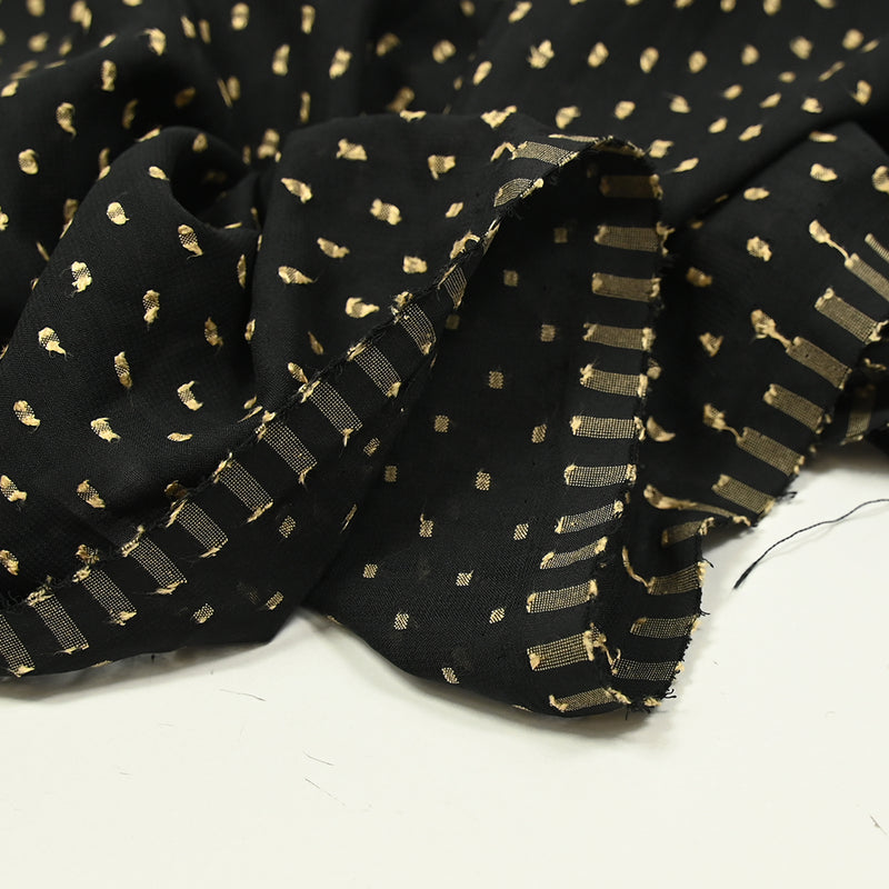Voile de polyester plumetis beige fond noir