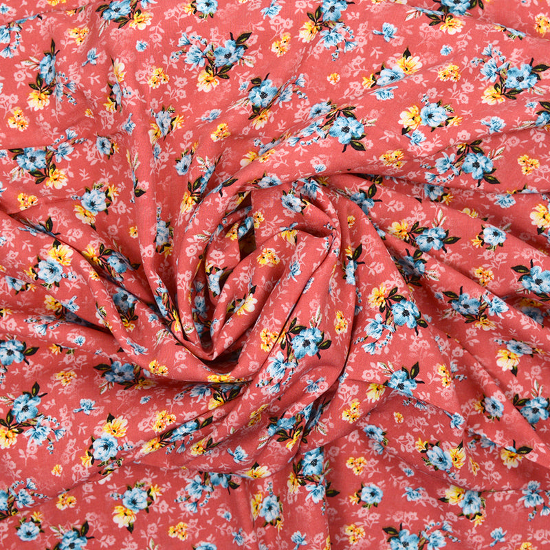 Viscose imprimée Emma fleurs bleu fond rose corail