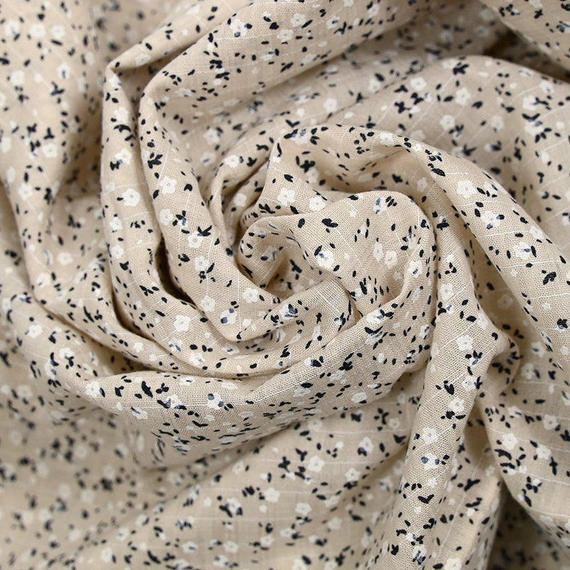 Voile de coton imprimé et floqué fleurettes fond beige clair
