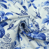Popeline de coton imprimée fleurs et oiseaux bleu fond blanc