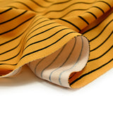 Textured polyester jersey thin black stripes mustard background