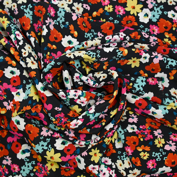 Crépon polyester fleuri multicolore fond noir