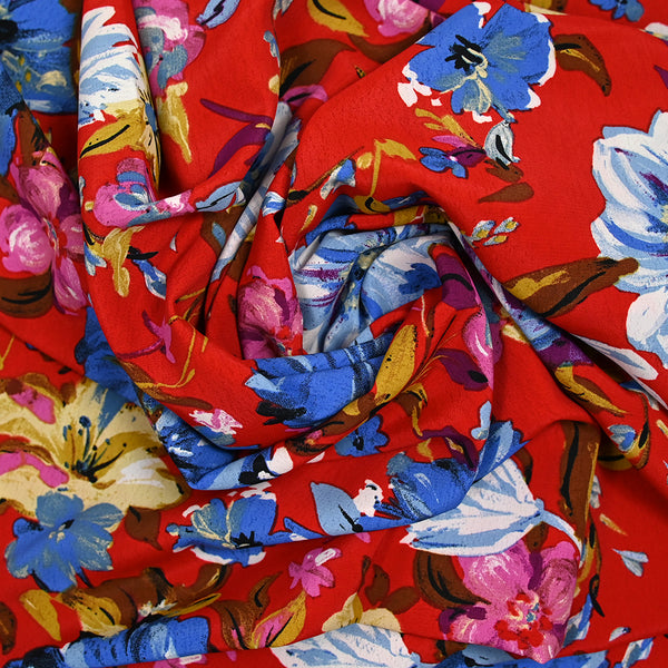 Crépon polyester jolie pivoine bleu fond rouge