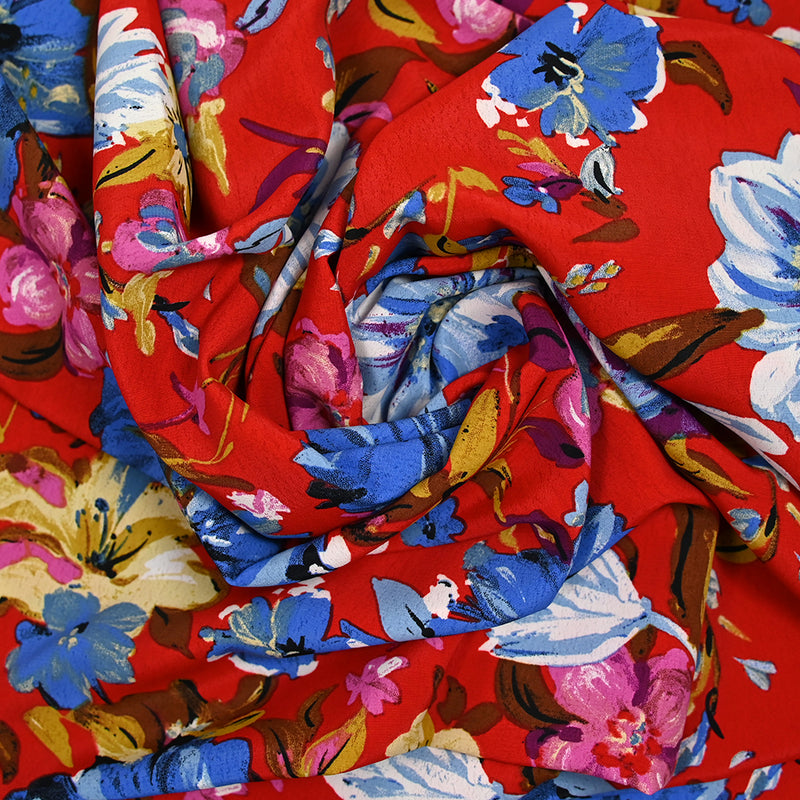 Crépon polyester jolie pivoine bleu fond rouge