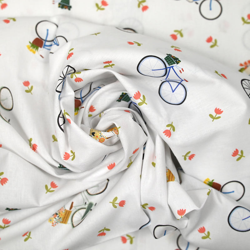 Coton imprimé balades à vélo fond blanc